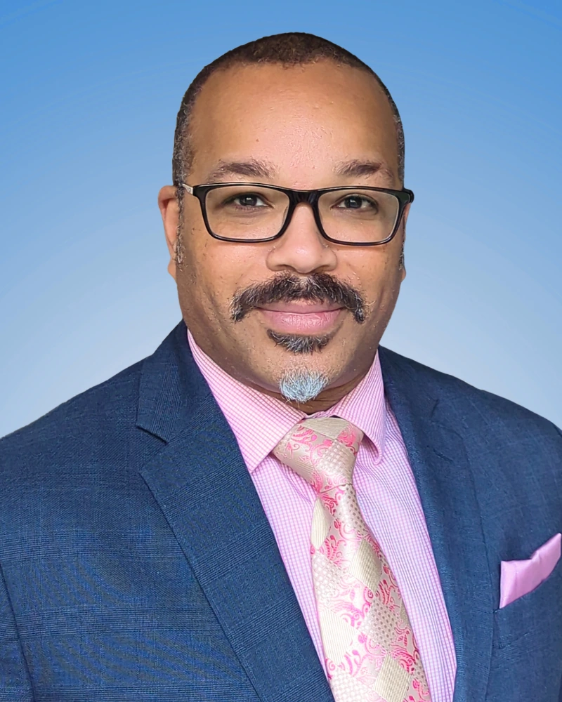 professional headshot with blue studio background from on-demand photography service