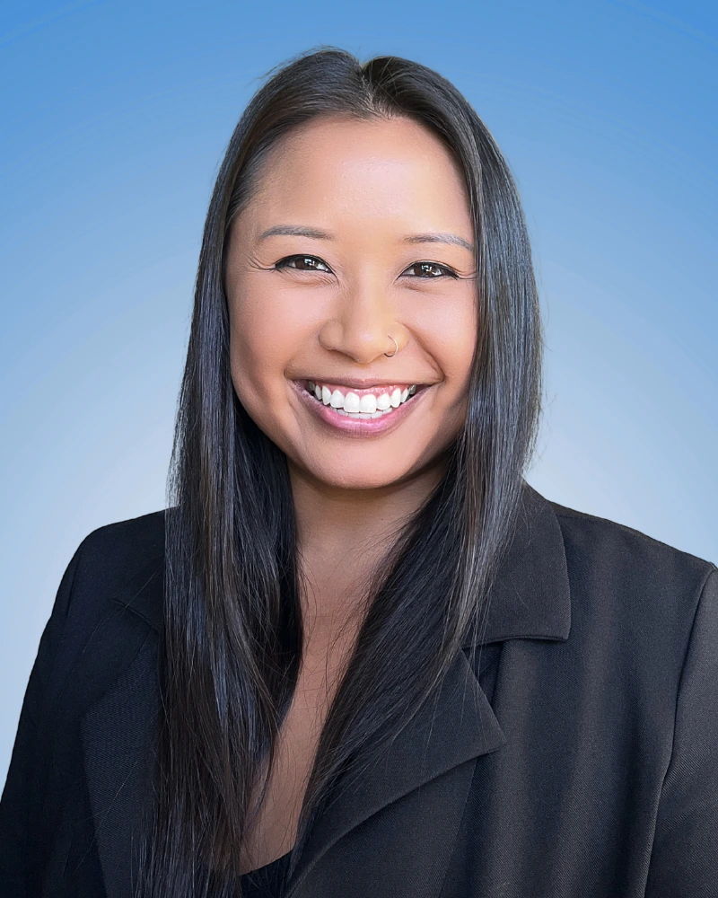 marketing professional headshot example showing creative confidence on blue background