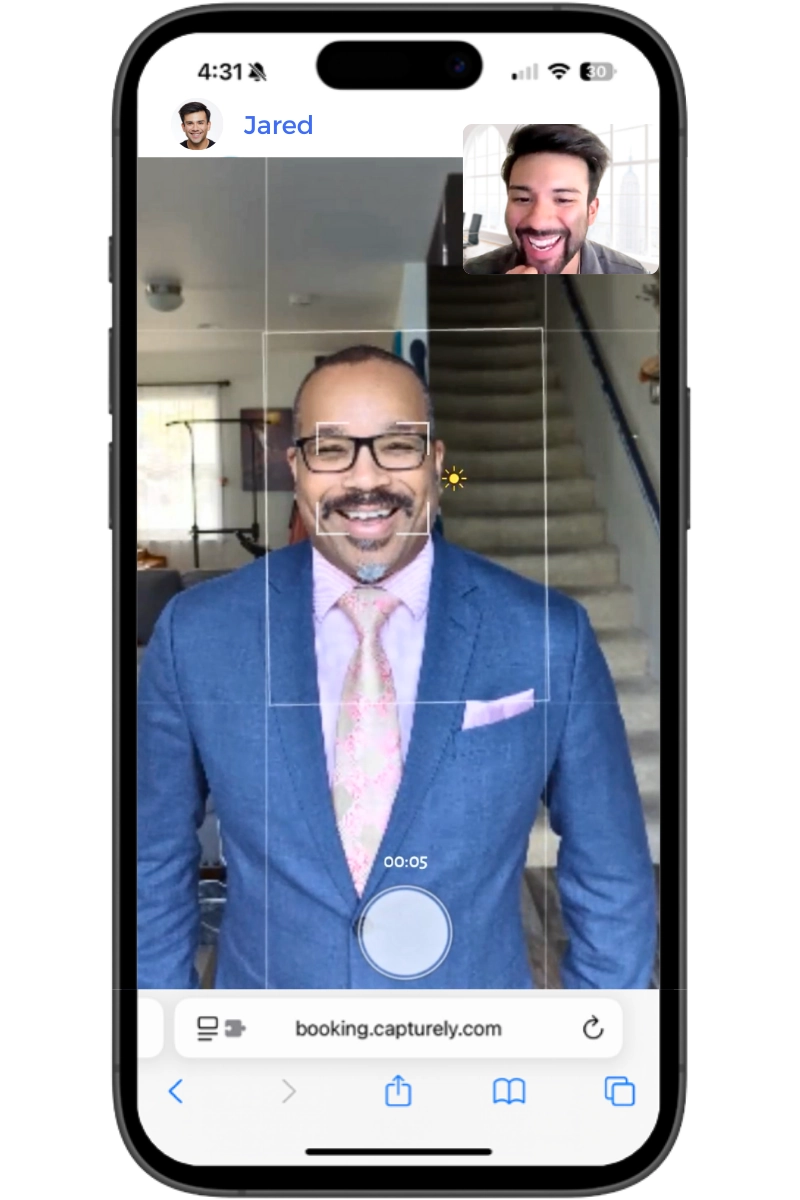 virtual LinkedIn headshot session showing phone camera with live photographer directing the shoot