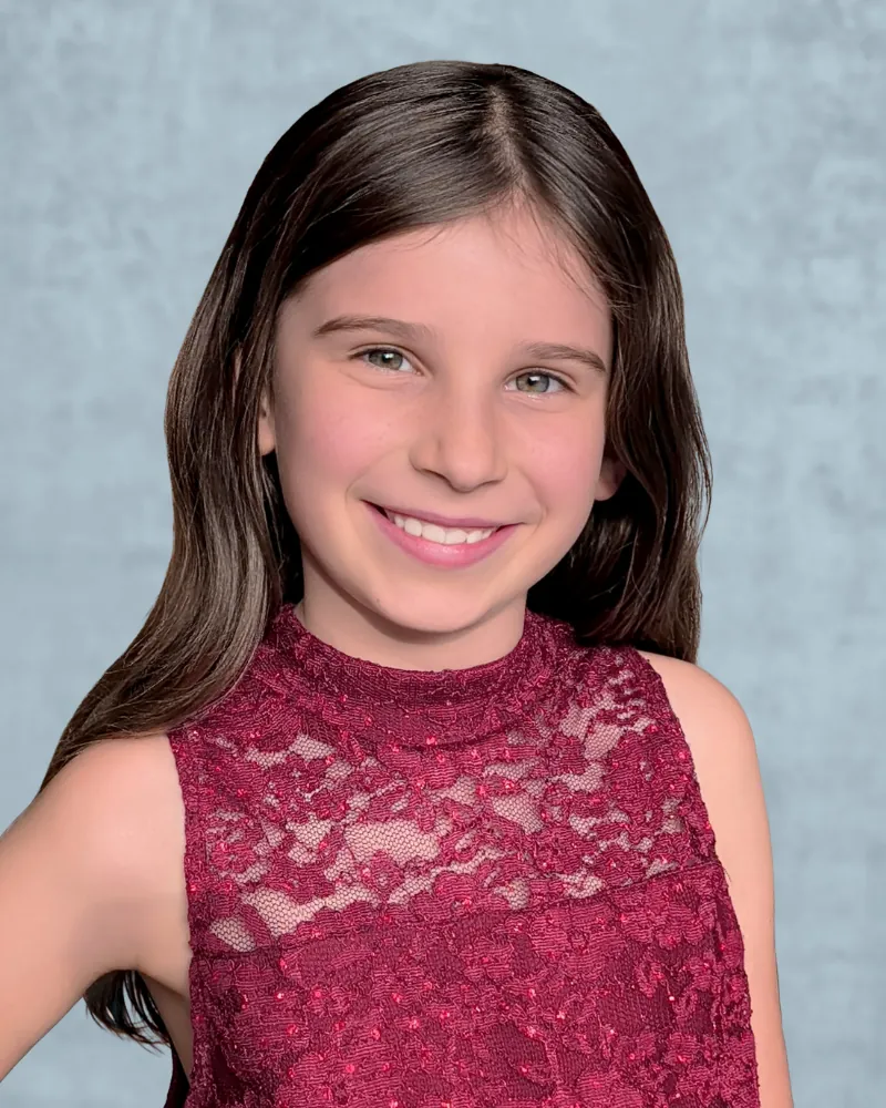 child actor headshot example showing natural smile and bright eyes that casting directors look for