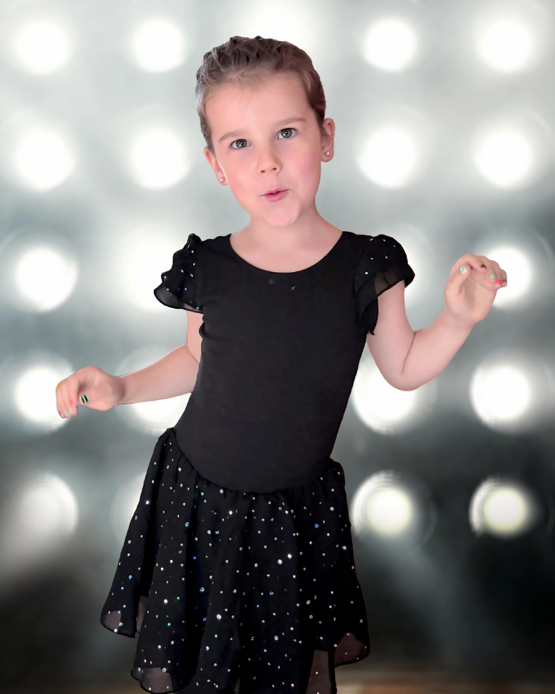 young girl in fun personality pose showing authentic expression during virtual school photo session