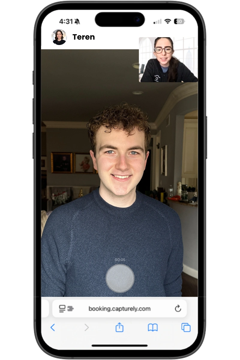 phone screen showing child portrait session being directed by professional photographer
