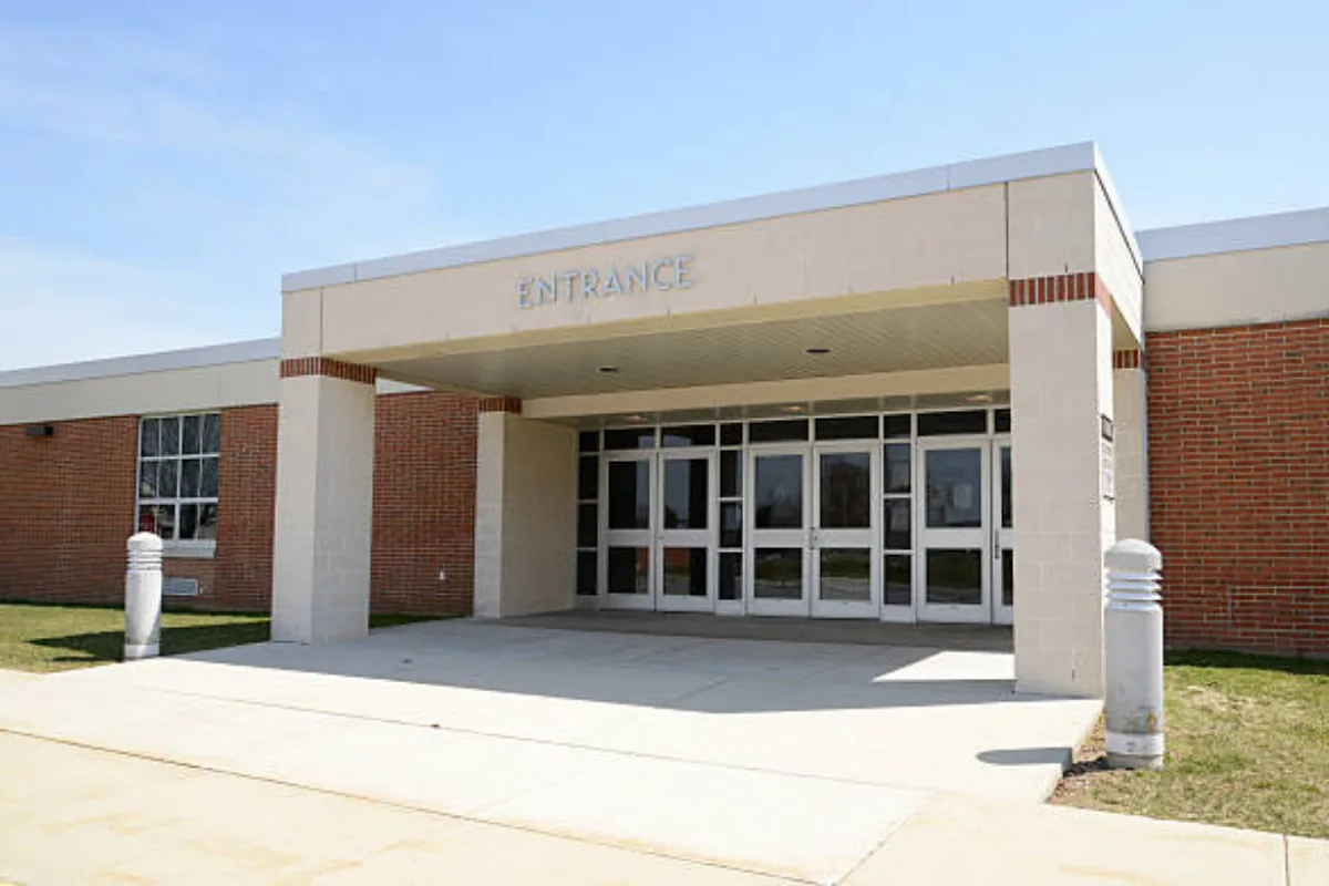school building where administrators coordinate teacher headshot day logistics