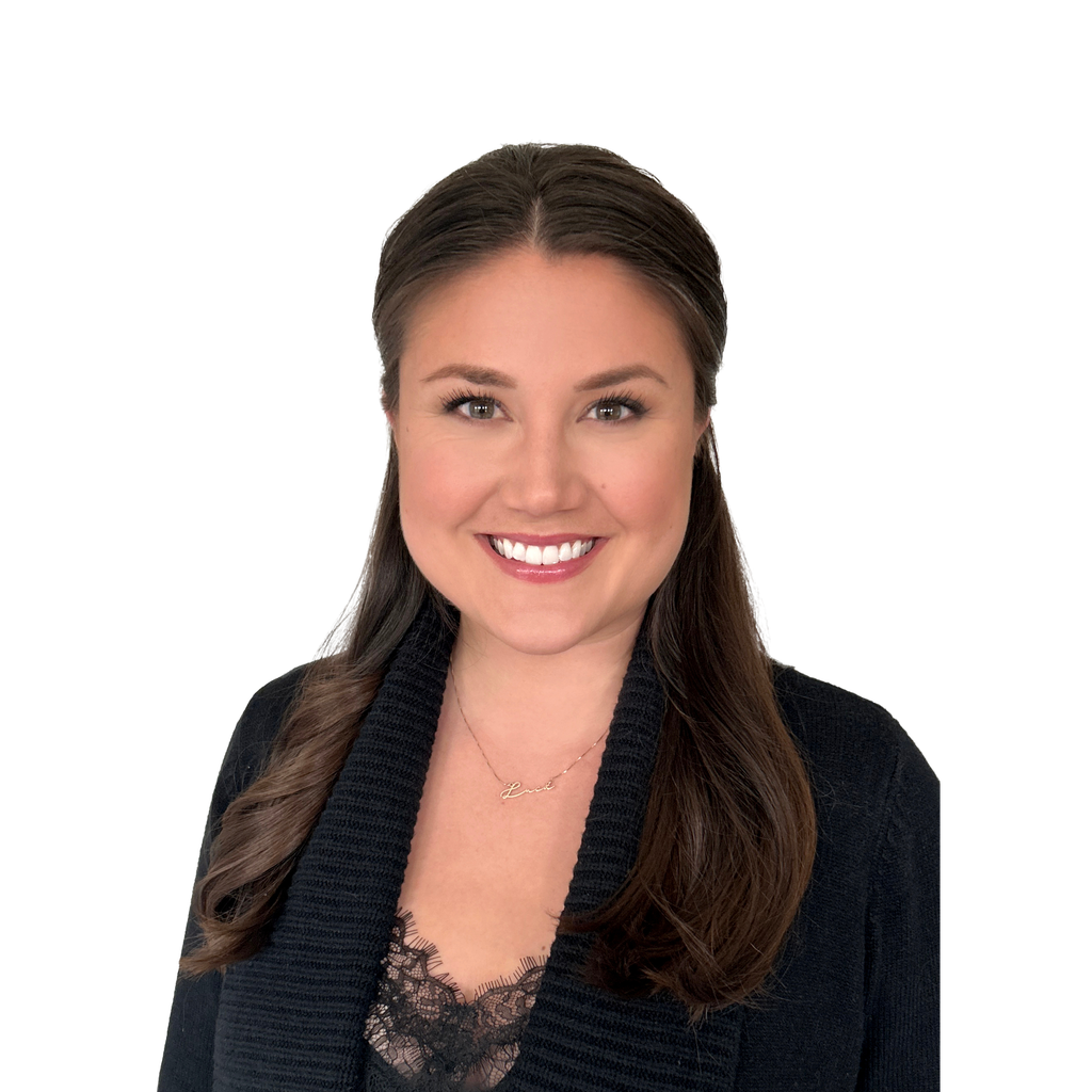 1. Female founder. Smiling woman with long dark hair, wearing a black cardigan over a lace top, set against a clean white background