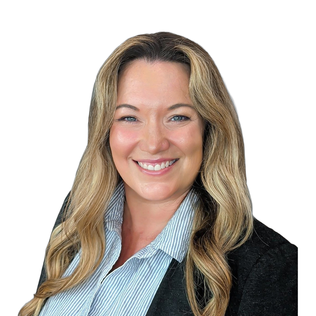 6. Female designer. Middle-aged woman with blonde hair wearing a blazer and striped shirt against a textured grey background. Casual but composed
